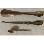 Three pieces of silver to include silver handled shoe horn and button hook Birmingham 1908 and spoon