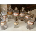 Eight 19thC pharmacy chemist liquid glass bottles. 7 x 22cm h, 1 x 17cm h. Provenance: Bratley