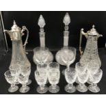 A selection of glass ware to include a pair of cut glass decanters 34cm, 2 x cut glass jugs with