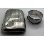 Hallmarked silver cigarette case and napkin ring. Total weight 60.4gm.Condition ReportBoth dented.