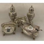 Silver to include 2 pepperettes maker Walker & Hall Sheffield 1909, 2 x salts Birmingham 1917 with