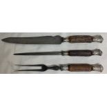 A Victorian three piece bone carving set with silver mounts. Blade marked Lee and Wigfull. Sheffield