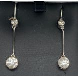 A pair of diamond drop earrings set in 18ct white gold. Drop from top diamond to bottom diamond 2.8