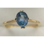 An 18 carat gold ring set with blue gem stone. Size M. 2gm.Condition ReportGood condition.