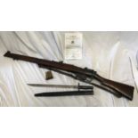 A Lee Enfield SMLE Number 1 MKIII 303 rifle deactivated, number W3802 with a 1907 leather sheathed