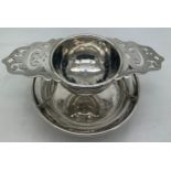 A silver tea strainer, Walker & Hall Sheffield 1932. 87.7gm.Condition ReportMinor dent to base and
