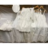 Selection of white linen nightdresses and bloomers with a night cap and underskirt.Condition