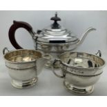 Three piece silver tea service. Birmingham 1933 Selfridge & Co Ltd. Total weight 432.2gm.Condition