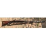 A .550 percussion (converted from flintlock) shotgun 35.75'' barrel, Brass trigger guard, brass on