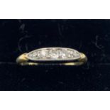 A five stone diamond ring set in 18ct gold. Weight 1.7gm. Size M.Condition ReportGood condition.