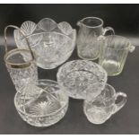 A quantity of good quality cut glass to include 3 bowls, 2 jugs and 2 ice buckets.Condition