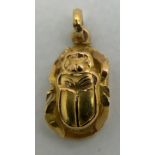 A yellow metal scarab beetle. Tests as 18ct. 1.6gm.Condition ReportGood condition.