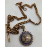 A 9ct gold chain, t bar and shilling fob set in a 9ct gold mount. Total weight 71.4gm. Weight of ch