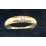 A 9 carat gold gypsy ring set with single diamond. 2.5gm. Size N.Condition ReportGood condition.