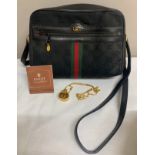 A vintage Gucci handbag and Gucci pendant scent bottle in original tissue.Condition ReportBoth in