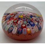 A millefiori glass paperweight. Approx. 8cm d.Condition ReportGood condition.