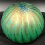 A John Ditchfield Glasform iridescent green paperweight approx. 8cm diameter, signed to the base and