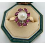 Ring marked .375 set with pearl, pink & white stones. Size L/M, weight 2.3gms.Condition ReportGood