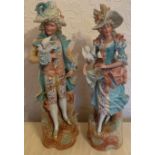 A pair of 19thC continental bisque figurines, a lady and gentlemen with doves. 47cm h.Condition