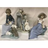 Nao Lladro figurines, Girl with Rabbits 17.5cm h, Girl with small bird 15.5cm h and an unmarked