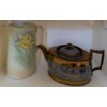 Copper lustre teapot and jug with daffodils.Condition ReportChip to teapot spout.