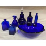 A selection of blue glass to include blue glass bowl marked "Italy" to the base. Tallest bottle 18.