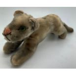 A vintage plush tiger 22cm l.Condition ReportWear to plush and staining.