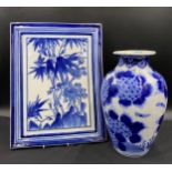 A 19thC Chinese blue and white vase together with a Chinese blue and white ceramic plaque.