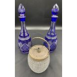 Two blue and clear cut glass decanters and plated biscuit barrel.Condition ReportWear to plate.