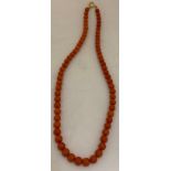 Coral bead necklace with an 18ct gold clasp. Weight 21gm.