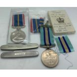 A Royal Observer Corps medal awarded to C. Obs E. Pearson together with a National Service medal and