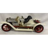 A Mamod steam roadster car. 39.5cm long approx.Condition ReportSlight signs of wear, crease to front