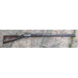 A 19thC single bore rifle steel barrel, length 80cms, wooden ramrod under barrel, engraved steel