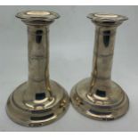 Pair of silver candlesticks, Sheffiels 1906, maker Harrison Bothers & Howson, 12cm h. Weighted