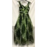A 1950's Marjon Couture evening dress in green shades with mesh outer layer, gathered waist and