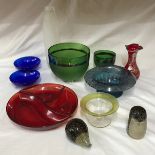 A collection of coloured glass ware to include 2 green bowls by Jane Charles, largest 20cm d,