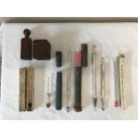 Three 19thC/20thC hydrometers together with a wooden box possibly a stamp, two floating dairy