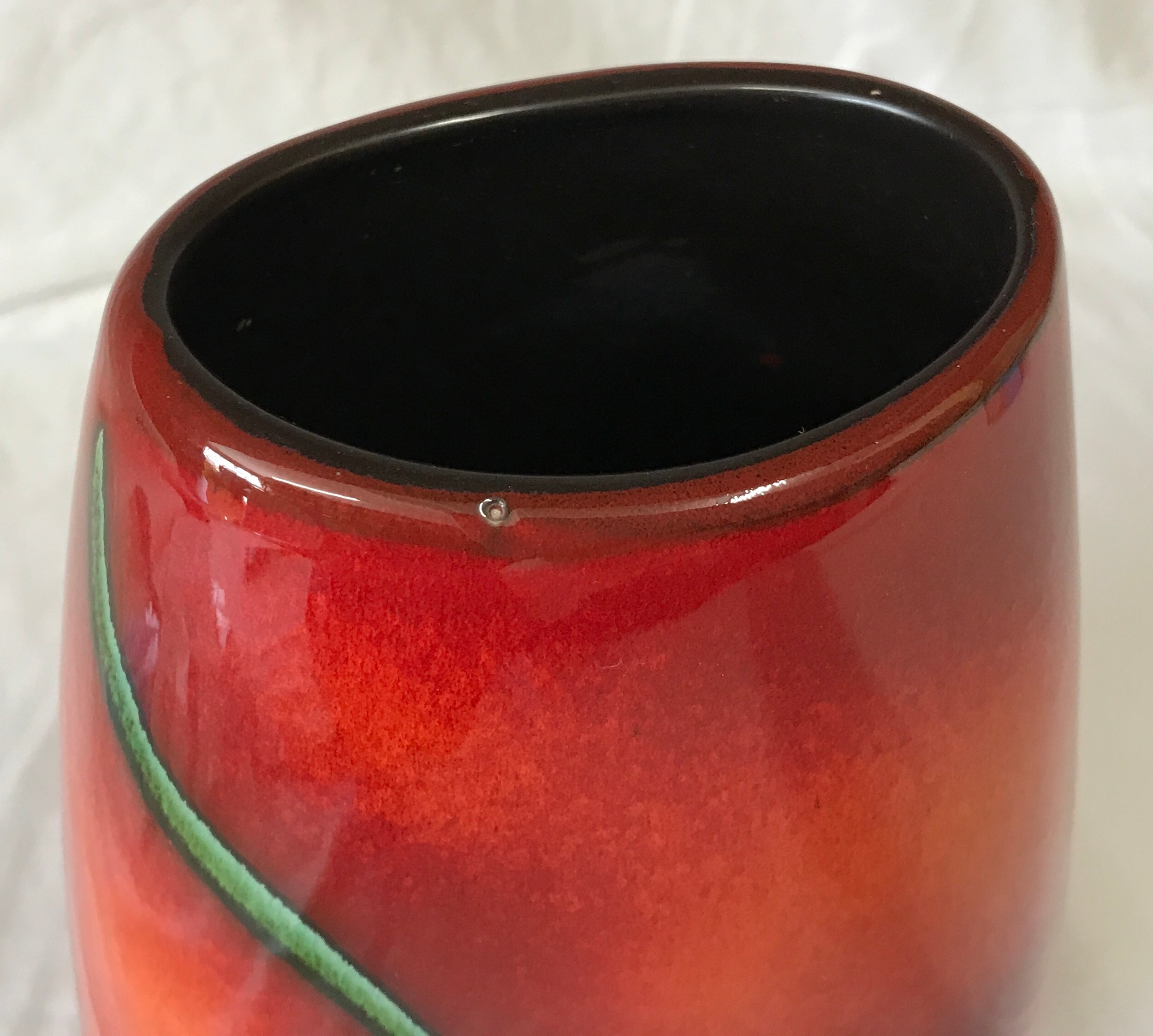 A Poole Pottery vase with Bee decoration to front on a red and orange glazed background. 25cms h. - Image 3 of 6