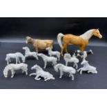 A collection of ceramic horses and cattle to include three Beswick, Beswick horse height 16cm and