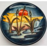 A Moorcroft circular dish with tube line decoration depicting bulrushes. 12cm h.Condition ReportGood
