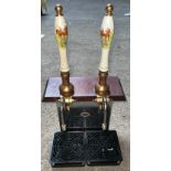 A pub double beer pump with ceramic handles of hunting design.