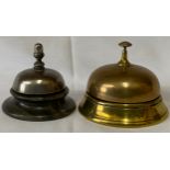 Two counter top bells, one brass push down and one metal on onyx base with twist mechanism to top.