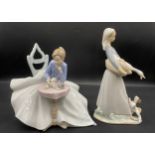 Two figurines to include Lladro Daisa and NAO figurine, playing with kitty 1355. Tallest 27cm h.