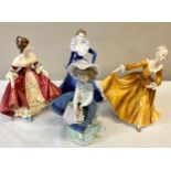 Four porcelain figures to include Lladro Pretty Pickings', Royal Doulton 'Southern Belle',
