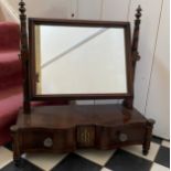 A mahogany swivel dressing table mirror with two drawers below.Condition ReportFairly good