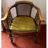 An early 20thC armchair with caned back and upholstered seat. 57 w x 52cm d.Condition ReportGood