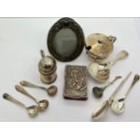 A quantity of silver to include caddy, salt and mustard spoons, mustard pot, pepper pot, oval