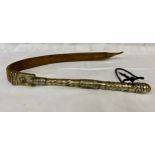 A white metal handled leather whip.Condition ReportWear to leather.