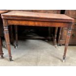 A 19thC mahogany fold over card table on turned legs and porcelain castors. 90 w x 44.5 d x 72cm h.