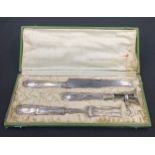 A cased french carving set.